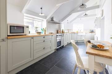 A breakfast table for two in the kitchen is the perfect place to sit and chat with the chef.