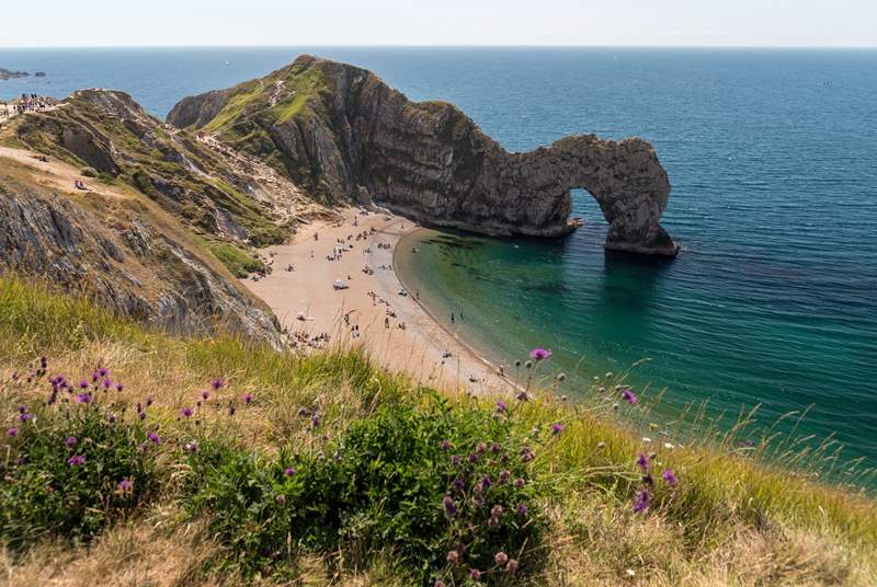 This is one of the treasures of the Dorset coast, Durdle Door. You can walk from the beautiful Lulworth Cove to Durdle Door and experience one of the most iconic scenes on the Jurassic Coast.
