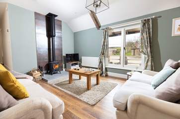 Kick back and relax on the comfy sofas whilst the log burner works it's magic.