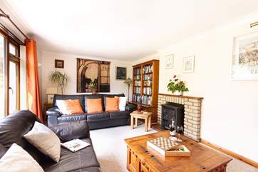 Snuggle up with a glass of red wine (the electric wood-burner is ornamental only and not for guests' use).