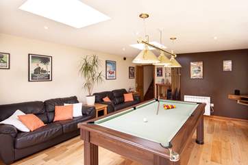 Many hours can be enjoyed playing a game of pool.