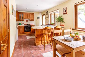 Enjoy leisurely breakfasts whilst planning your day ahead, at the end of the kitchen the door leads to the utility-room and stairs to the games-room.