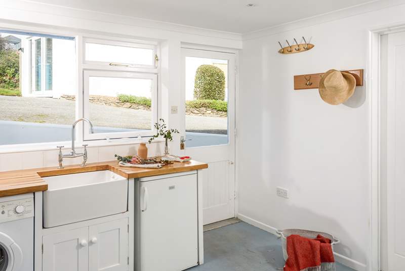 The back door leads into a handy utility-room, perfect for wellies and wetsuits.