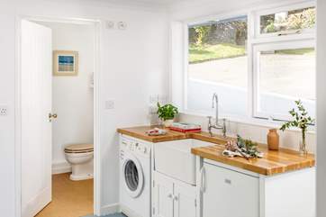 The utility-room has a useful second fridge.