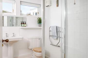 The family bathroom has both a shower and a bath.