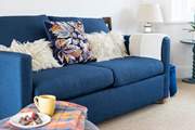 The open plan living space has gorgeous comfy sofas.