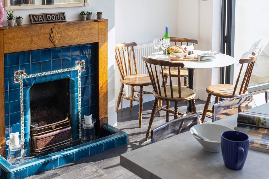 This striking ornamental fireplace is in the dining area.