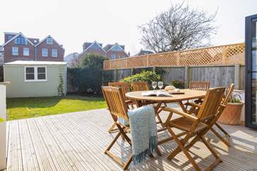 The deck is made for al fresco dining from dawn til dusk.