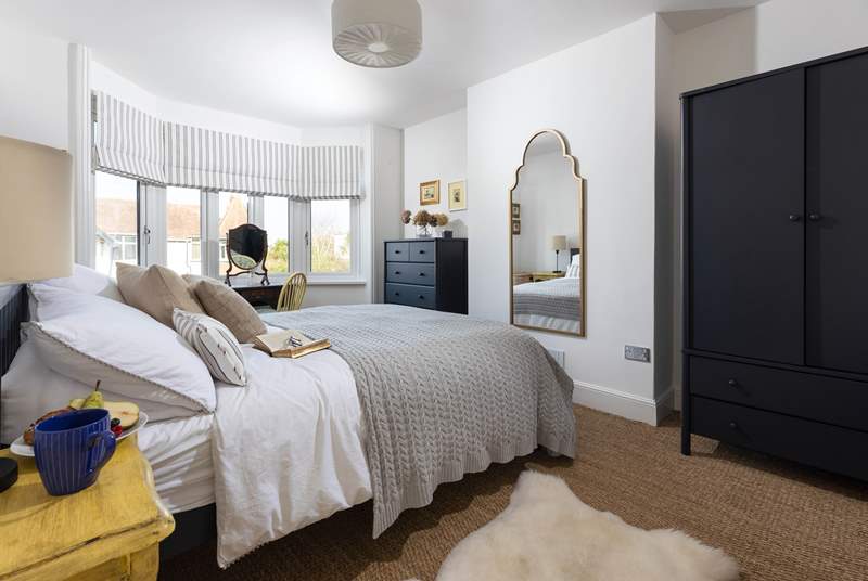 The dreamy main bedroom has a gorgeous king-size bed.
