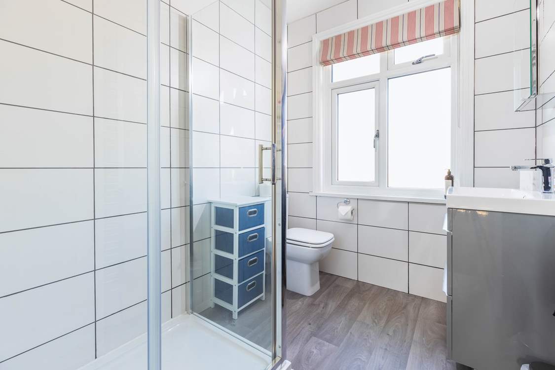 The family shower-room has a double shower cubicle.