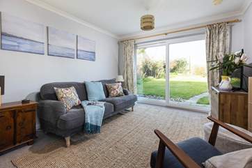 Plenty of space in the sitting/dining-room to enjoy time together or open the patio doors and let the sun and flood in.