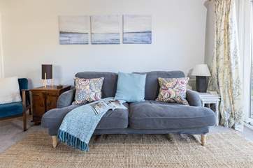 The sitting-room is lovely and homely, the perfect place to snuggle up with a good book.