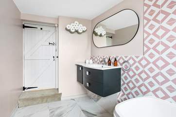 A step leads down into the bathroom.