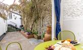 The pretty terrace festooned with fabulous creepers is the perfect place for al fresco dining. - Thumbnail Image