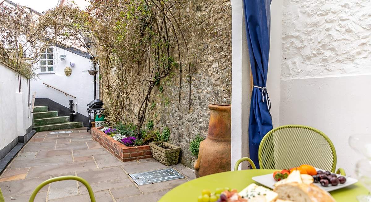 The pretty terrace festooned with fabulous creepers is the perfect place for al fresco dining.