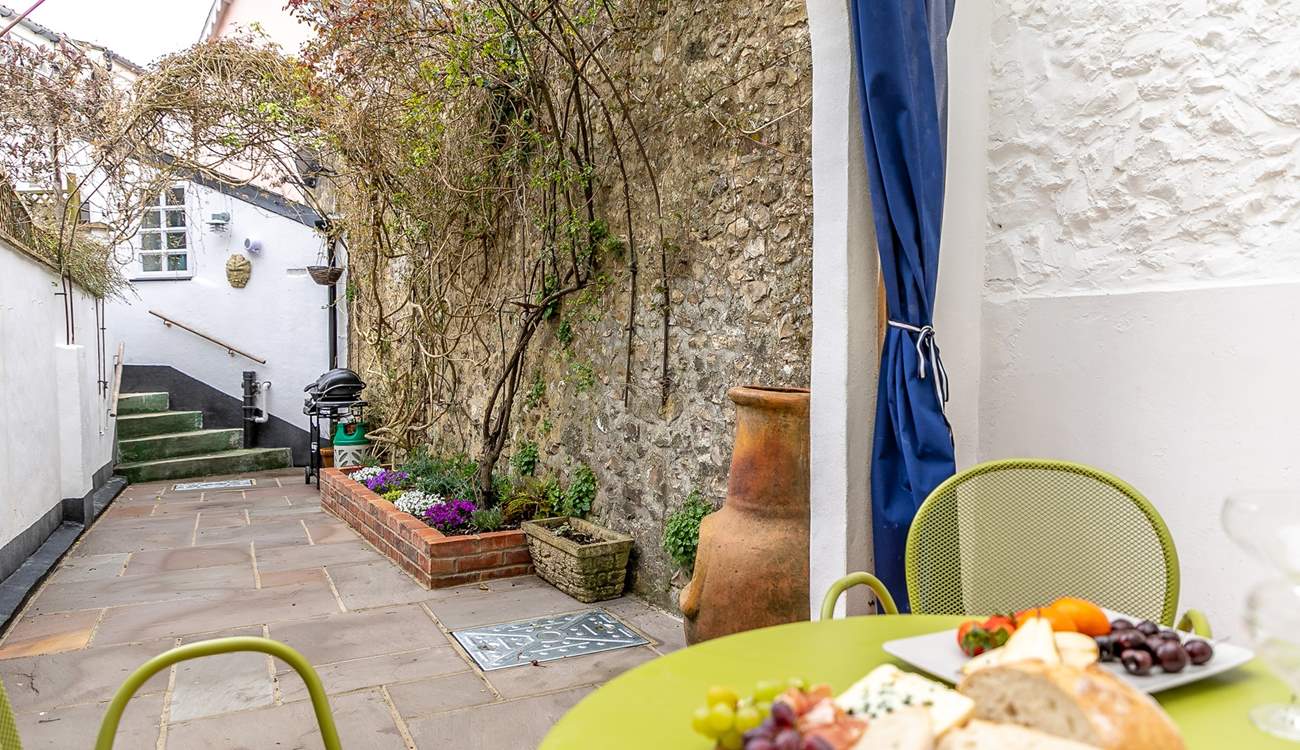 The pretty terrace festooned with fabulous creepers is the perfect place for al fresco dining.