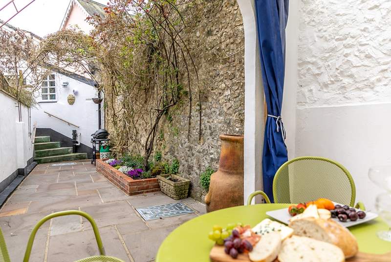 The pretty terrace festooned with fabulous creepers is the perfect place for al fresco dining.