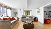 This super spacious living space leads into the dining-room.