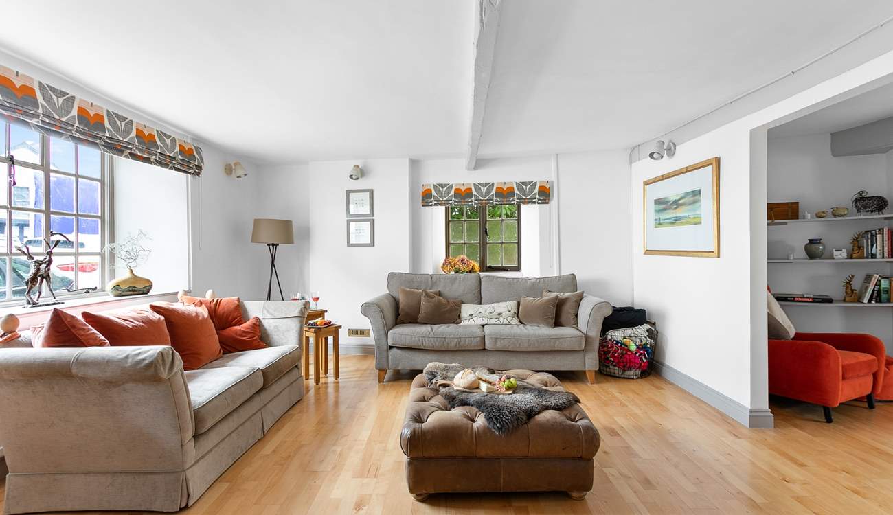 This super spacious living space leads into the dining-room.