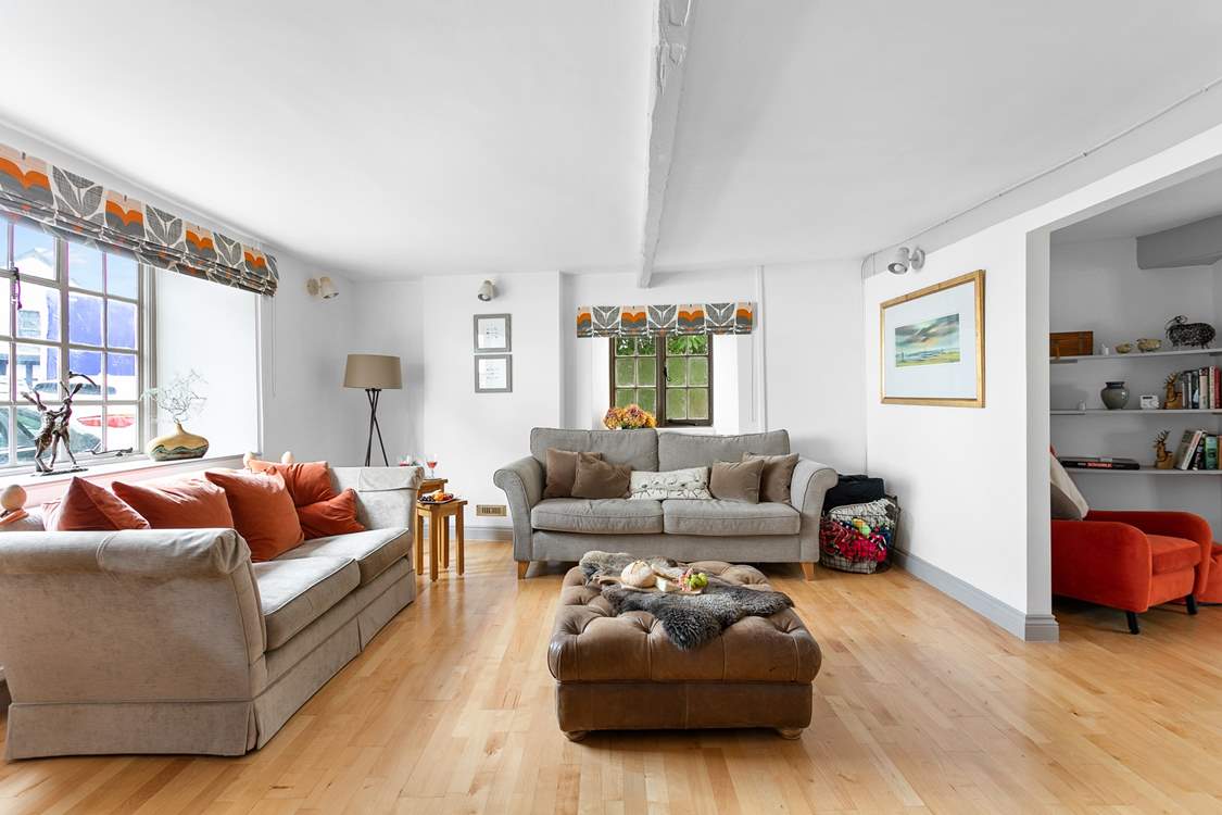 This super spacious living space leads into the dining-room.