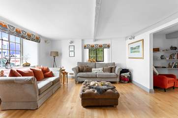 This super spacious living space leads into the dining-room.