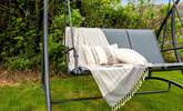 Grab a book and chill out on the swing chair. - Thumbnail Image