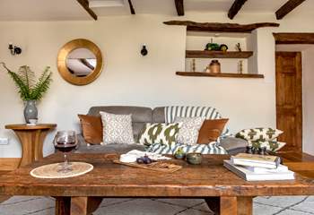 The wonderful rustic coffee table in the sitting-room, is the perfect addition for this charming farmhouse.