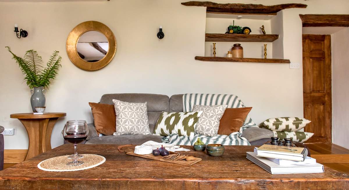 The wonderful rustic coffee table in the sitting-room, is the perfect addition for this charming farmhouse.