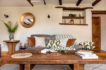 The wonderful rustic coffee table in the sitting-room, is the perfect addition for this charming farmhouse