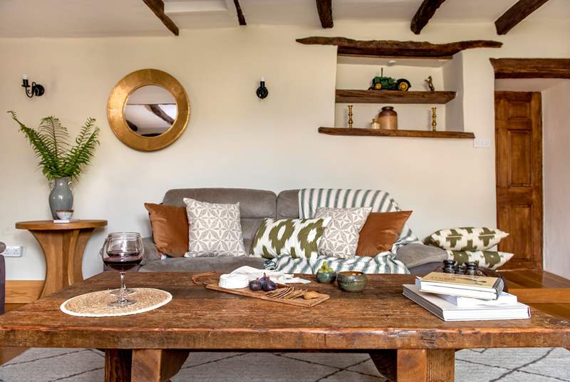 The wonderful rustic coffee table in the sitting-room, is the perfect addition for this charming farmhouse.