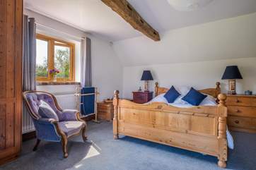 Another view of the main bedroom with gorgeous original beams.