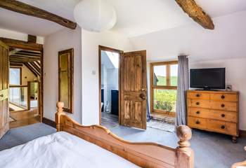 The characterful main bedroom with door leading to the en suite.