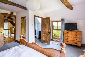 The characterful main bedroom with door leading to the en suite.