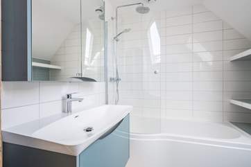 The upstairs family bathroom with bath and shower.