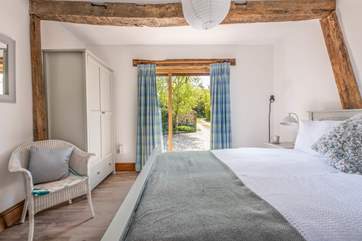 With door and couple of steps leading to the courtyard.