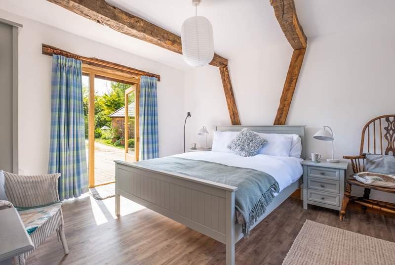 Peaceful sleeps in this relaxing ground floor bedroom with a couple of steps leading to the courtyard.