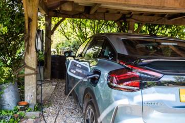 There is a complementary charger for electric cars.