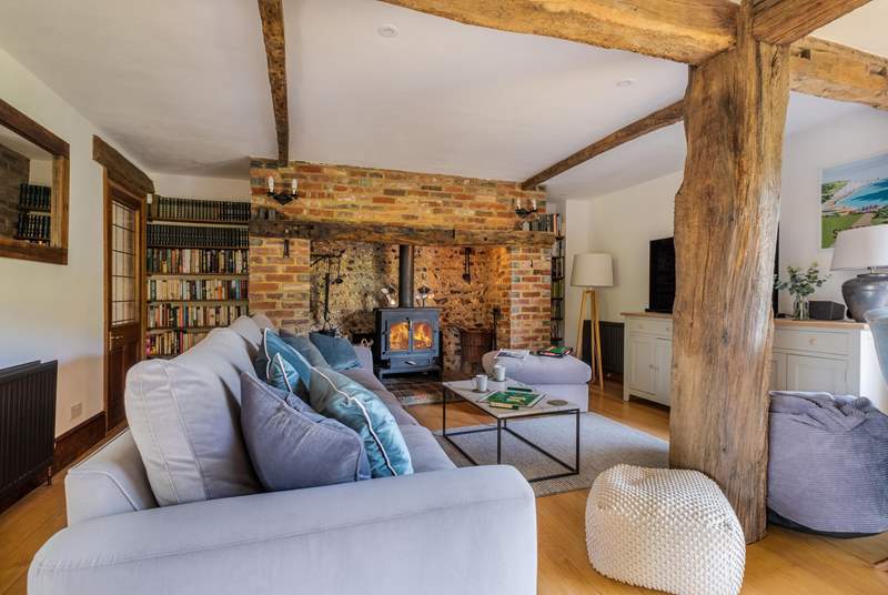 The gorgeous sitting-room is bursting with character and has an inglenook fireplace with wood-burning stove for those chilly afternoons or evenings.