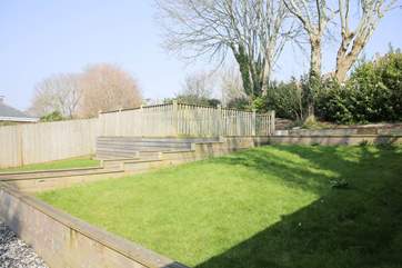 The sunny communal gardens are yours to enjoy. (There are garden chairs for your use, kept in the storage area).