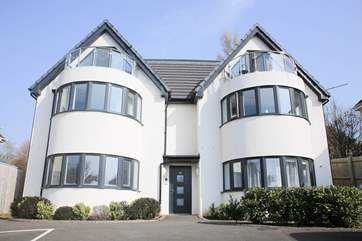 No 1 By The Sea is on the ground floor, on the left.