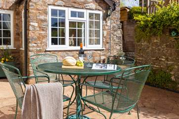 The sunny patio is the perfect spot for an evening drink and barbecue.