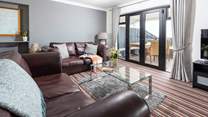 Large comfy sofas with views over the garden and out to sea.