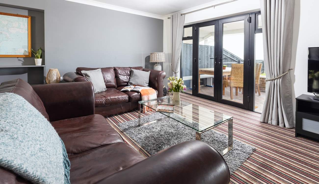 Large comfy sofas with views over the garden and out to sea.