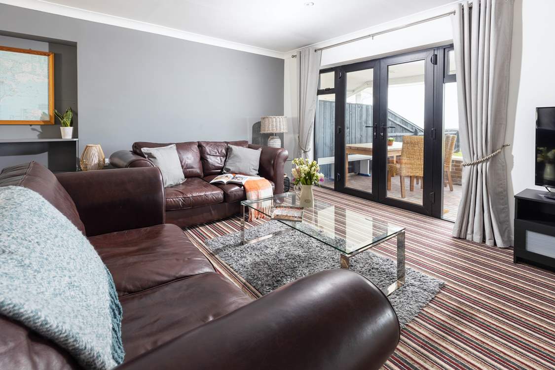 Large comfy sofas with views over the garden and out to sea.