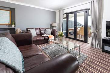 Large comfy sofas with views over the garden and out to sea.