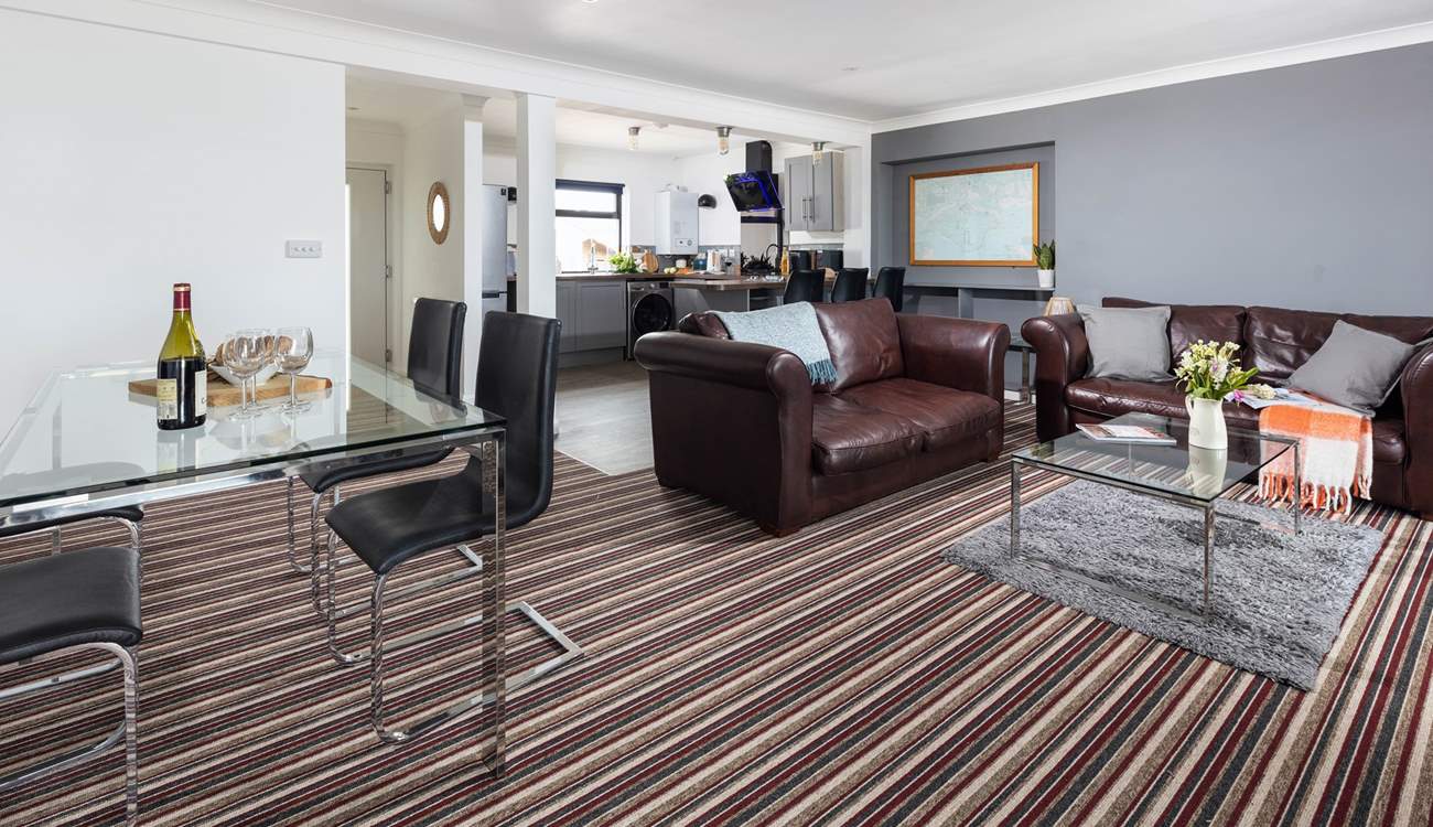 The open plan space has lots of room to enjoy watching the chef at work, eating together or just cosying up on the sofa.