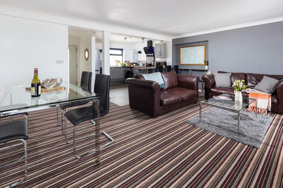 The open plan space has lots of room to enjoy watching the chef at work, eating together or just cosying up on the sofa.