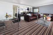 The open plan space has lots of room to enjoy watching the chef at work, eating together or just cosying up on the sofa.