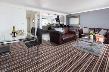 The open plan space has lots of room to enjoy watching the chef at work, eating together or just cosying up on the sofa.