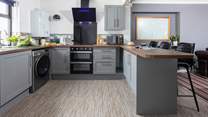 Take a seat at the breakfast-bar, the perfect place to watch the chef cooking up a feast.